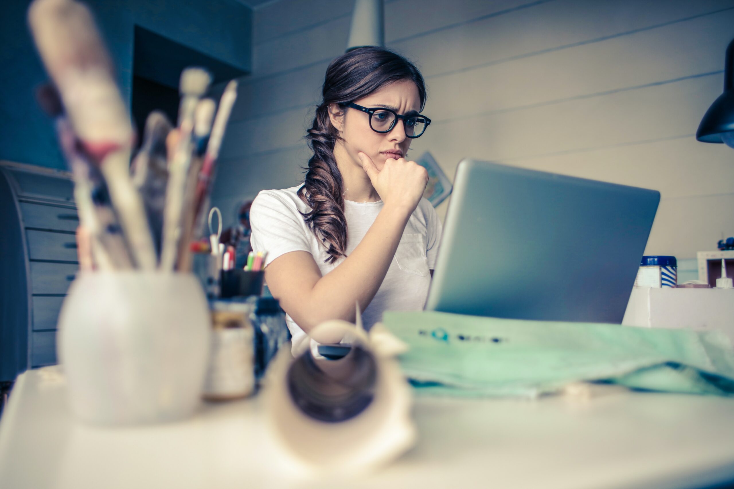 Concerned woman looking at laptop